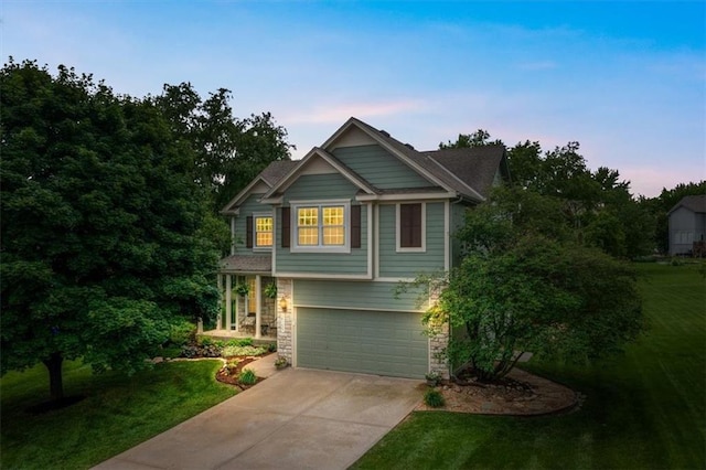 14155 W 147th Ter, Olathe, KS 66062 - craftsman inspired home featuring concrete driveway, stone siding, an attached garage, and a lawn