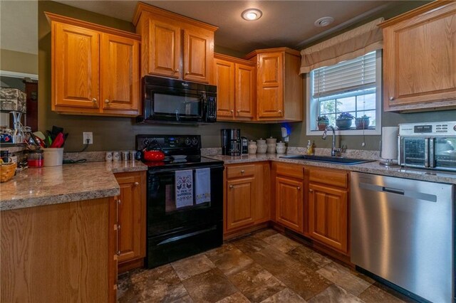 2943 NE Turkey Rd, Breckenridge, MO 64625 - kitchen with black appliances, a sink, stone finish floors, light countertops, and brown cabinets
