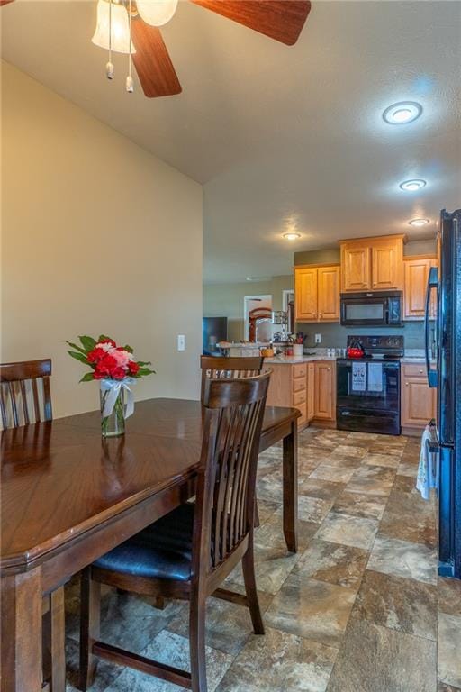 2943 NE Turkey Rd, Breckenridge, MO 64625 - dining room featuring a ceiling fan, light stone finish flooring, and recessed lighting