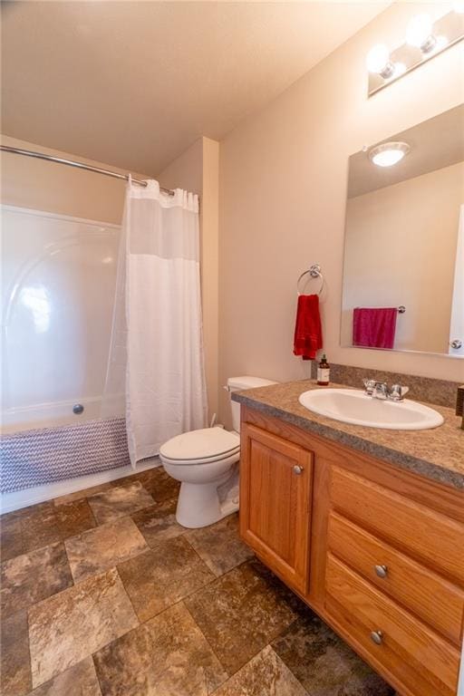 2943 NE Turkey Rd, Breckenridge, MO 64625 - full bathroom with stone finish floors, vanity, toilet, and a shower with shower curtain