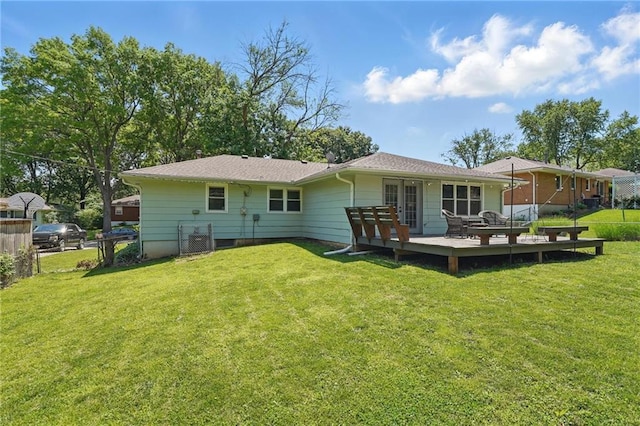 109 N 1st St, Blue Springs, MO 64014 - rear view of house with a wooden deck and french doors