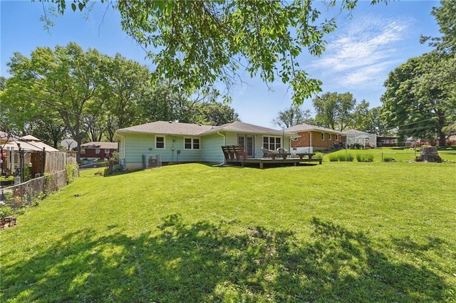 109 N 1st St, Blue Springs, MO 64014 - rear view of property featuring a wooden deck