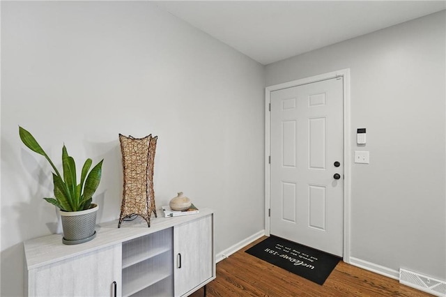 109 N 1st St, Blue Springs, MO 64014 - entryway with dark wood-style floors and baseboards