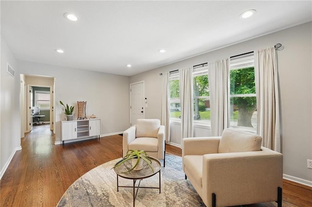 109 N 1st St, Blue Springs, MO 64014 - living area with baseboards, wood finished floors, and recessed lighting