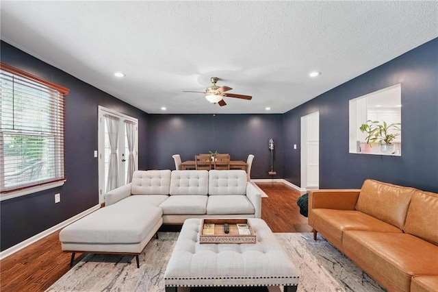 109 N 1st St, Blue Springs, MO 64014 - living area featuring wood finished floors, a ceiling fan, baseboards, and recessed lighting
