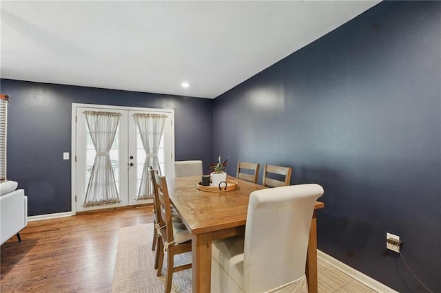 109 N 1st St, Blue Springs, MO 64014 - dining room featuring baseboards, wood finished floors, and french doors
