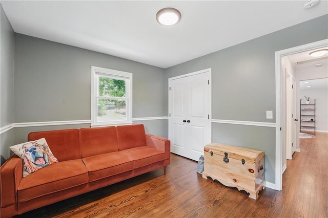109 N 1st St, Blue Springs, MO 64014 - living area featuring wood finished floors and baseboards