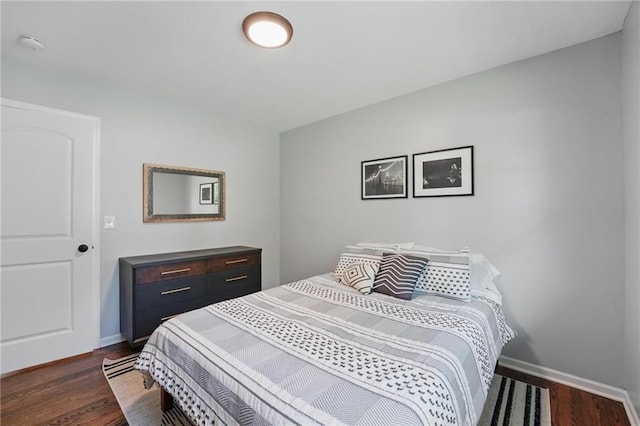 109 N 1st St, Blue Springs, MO 64014 - bedroom with dark wood finished floors and baseboards