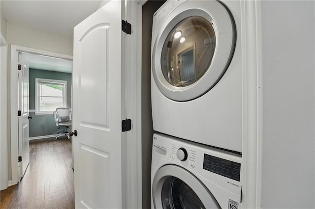 109 N 1st St, Blue Springs, MO 64014 - laundry area featuring stacked washer and clothes dryer and dark wood-style floors