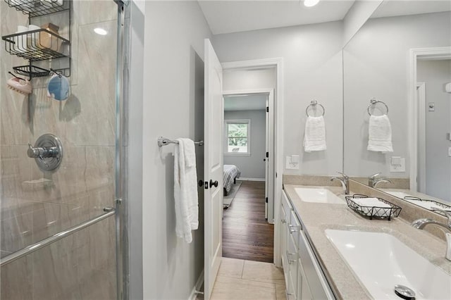 109 N 1st St, Blue Springs, MO 64014 - full bathroom featuring ensuite bath, a shower stall, double vanity, and baseboards