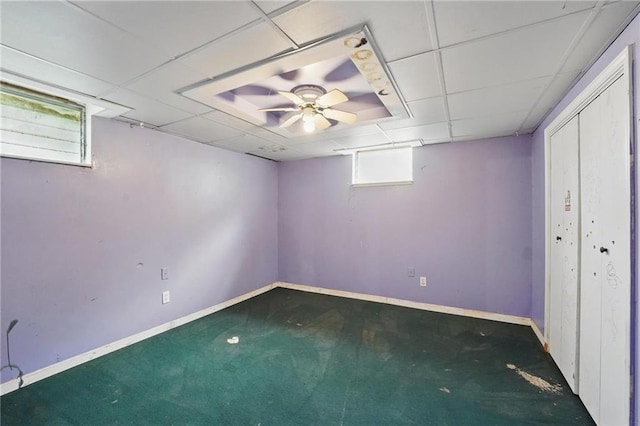 109 N 1st St, Blue Springs, MO 64014 - below grade area featuring carpet floors, baseboards, and a paneled ceiling