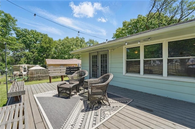 109 N 1st St, Blue Springs, MO 64014 - wooden terrace featuring french doors