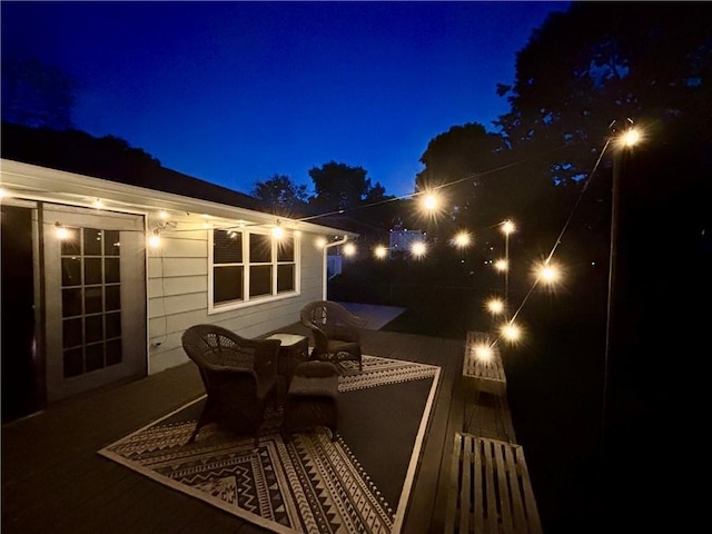109 N 1st St, Blue Springs, MO 64014 - deck at night with outdoor dining area