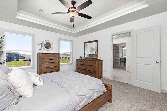 20786 Emerald St, Spring Hill, KS 66083 - carpeted bedroom with a raised ceiling, ornamental molding, and a ceiling fan