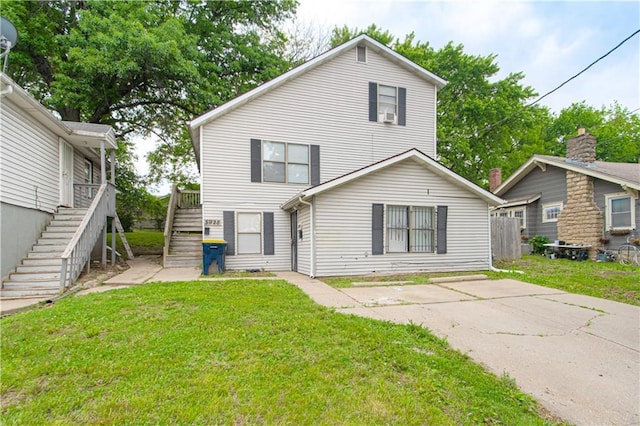 5926 Agnes Ave, Kansas City, MO 64130 - view of front of property featuring stairway and a front lawn