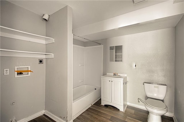 5926 Agnes Ave, Kansas City, MO 64130 - bathroom with wood finished floors, vanity, tub / shower combination, and baseboards