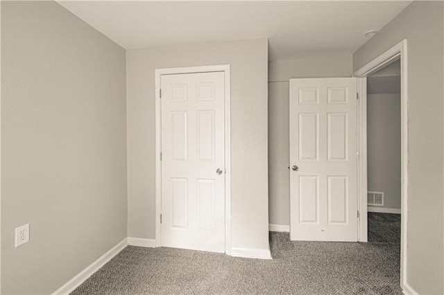 5926 Agnes Ave, Kansas City, MO 64130 - unfurnished bedroom with carpet and baseboards