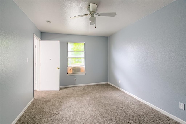 5926 Agnes Ave, Kansas City, MO 64130 - unfurnished room with carpet, a ceiling fan, baseboards, and a textured wall