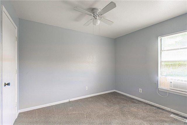 5926 Agnes Ave, Kansas City, MO 64130 - carpeted spare room featuring a ceiling fan and baseboards