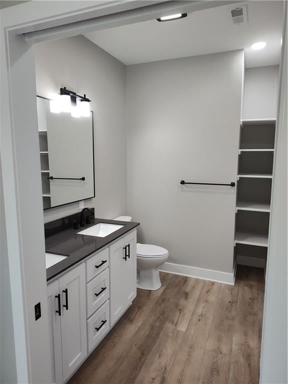 802 E N Main St, Richmond, MO 64085 - full bathroom featuring double vanity and wood finished floors