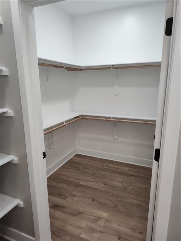 802 E N Main St, Richmond, MO 64085 - spacious closet featuring dark wood finished floors