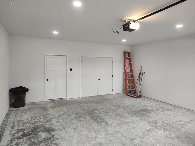 802 E N Main St, Richmond, MO 64085 - garage featuring a garage door opener and recessed lighting