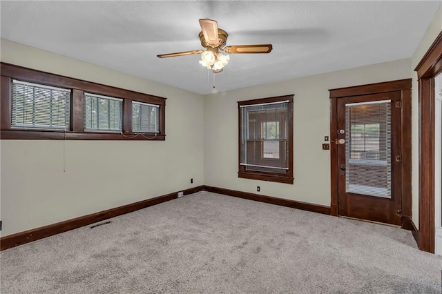 1403 S Sterling Ave, Independence, MO 64052 - spare room with carpet, baseboards, and ceiling fan
