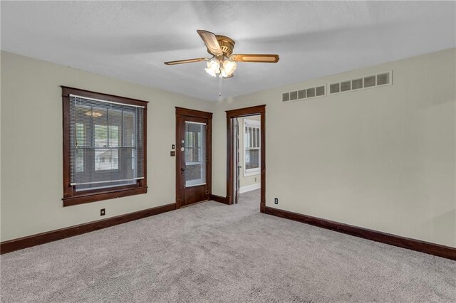 1403 S Sterling Ave, Independence, MO 64052 - spare room with carpet flooring, baseboards, and a ceiling fan