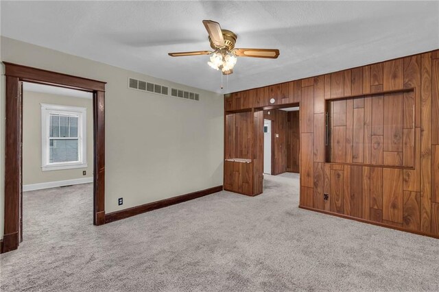1403 S Sterling Ave, Independence, MO 64052 - carpeted empty room featuring ceiling fan and baseboards