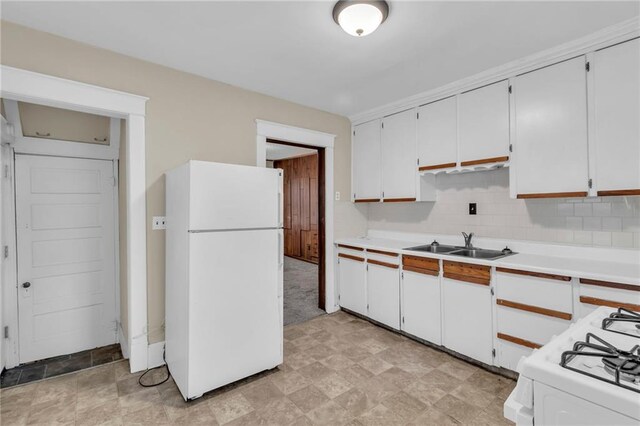 1403 S Sterling Ave, Independence, MO 64052 - kitchen with white appliances, a sink, light countertops, and white cabinets