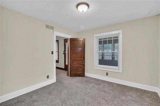 1403 S Sterling Ave, Independence, MO 64052 - unfurnished room with carpet flooring and baseboards