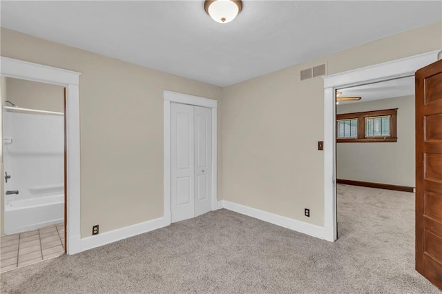1403 S Sterling Ave, Independence, MO 64052 - unfurnished bedroom with carpet, baseboards, and connected bathroom