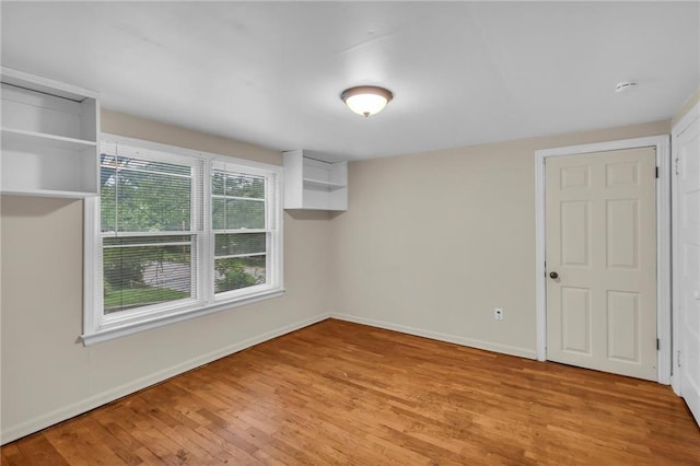 1403 S Sterling Ave, Independence, MO 64052 - spare room with wood finished floors and baseboards