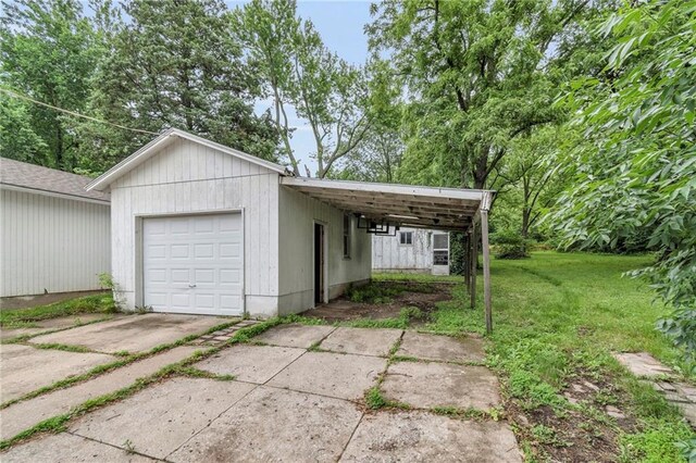 1403 S Sterling Ave, Independence, MO 64052 - garage featuring concrete driveway