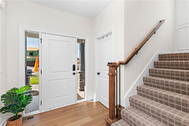 20714 Emerald St, Spring Hill, KS 66030 - entryway featuring light wood finished floors and stairs