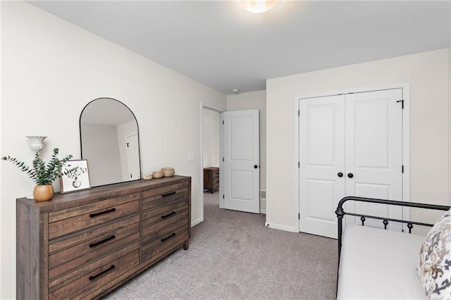20714 Emerald St, Spring Hill, KS 66030 - bedroom with light colored carpet, a closet, and baseboards