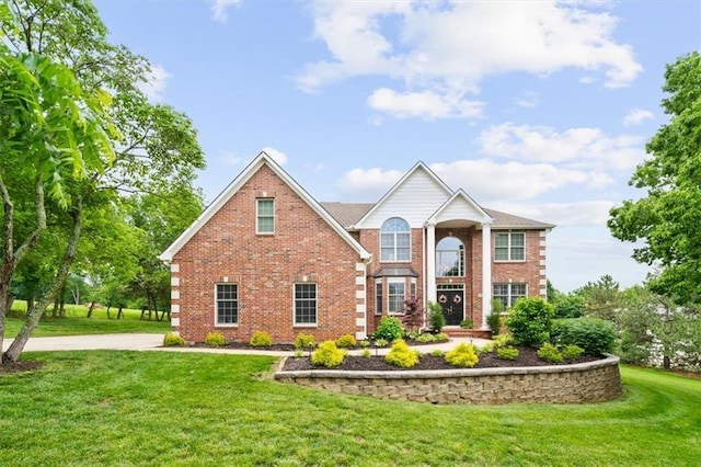 7007 Bell Rd, Shawnee, KS 66217 - view of front of home featuring brick siding and a front lawn