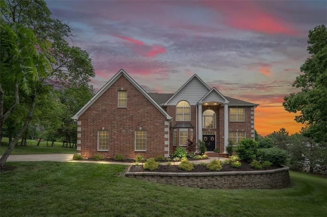 7007 Bell Rd, Shawnee, KS 66217 - view of front of house featuring a front lawn and brick siding