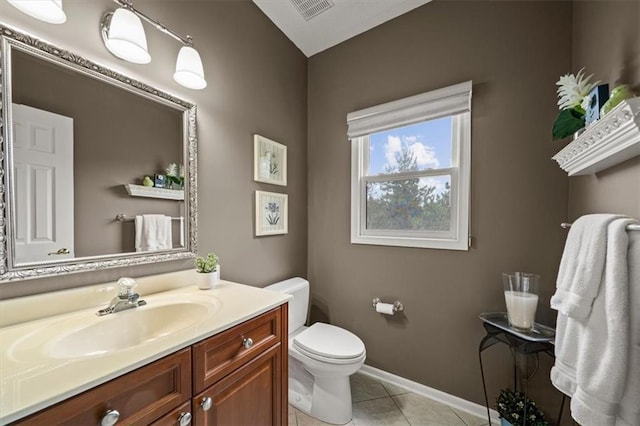 7007 Bell Rd, Shawnee, KS 66217 - half bathroom featuring toilet, tile patterned flooring, vanity, and baseboards