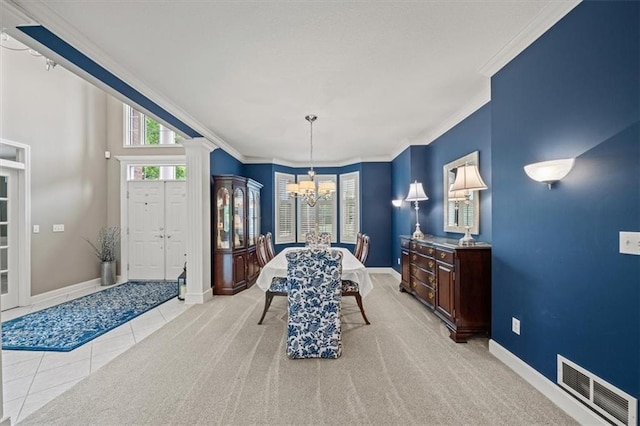 7007 Bell Rd, Shawnee, KS 66217 - dining space featuring a chandelier, ornamental molding, plenty of natural light, baseboards, and ornate columns