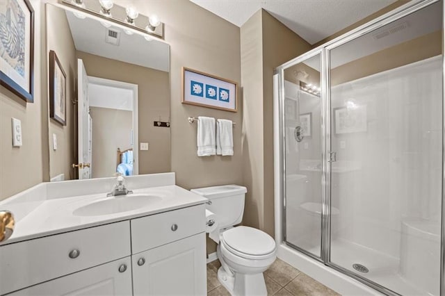 7007 Bell Rd, Shawnee, KS 66217 - bathroom featuring toilet, a shower stall, vanity, and tile patterned flooring