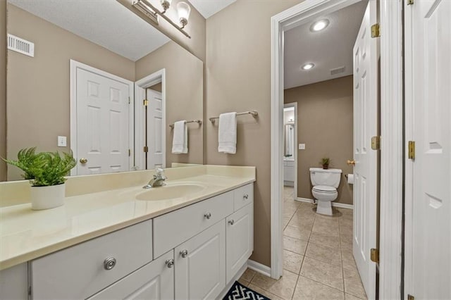 7007 Bell Rd, Shawnee, KS 66217 - bathroom featuring vanity, tile patterned floors, toilet, and baseboards