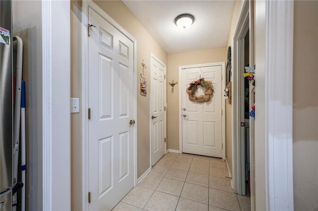 15141 S Symphony Dr Unit 1300, Olathe, KS 66062 - entryway featuring light tile patterned floors and baseboards