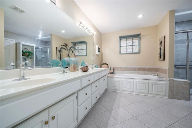 15141 S Symphony Dr Unit 1300, Olathe, KS 66062 - bathroom featuring a shower stall, a garden tub, tile patterned flooring, double vanity, and recessed lighting