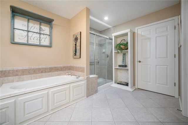 15141 S Symphony Dr Unit 1300, Olathe, KS 66062 - bathroom with a bath, a stall shower, tile patterned flooring, and recessed lighting
