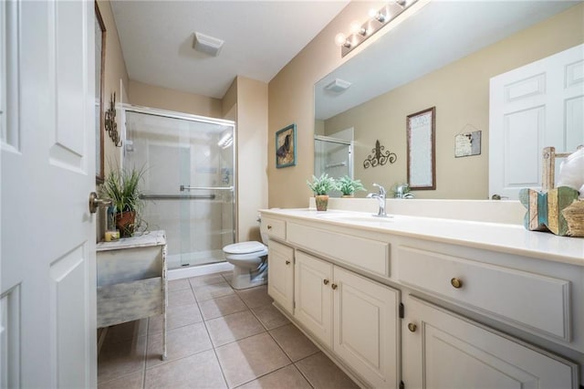 15141 S Symphony Dr Unit 1300, Olathe, KS 66062 - bathroom with toilet, vanity, a stall shower, and tile patterned flooring
