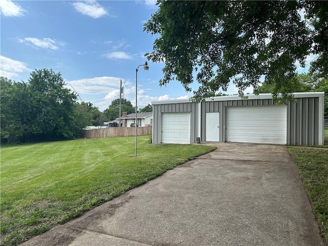 609 N Broadway St, Knob Noster, MO 65336 - view of yard featuring an outdoor structure and a detached garage