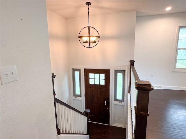609 N Broadway St, Knob Noster, MO 65336 - entryway featuring a chandelier, wood finished floors, stairway, and baseboards