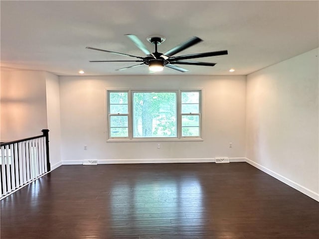 609 N Broadway St, Knob Noster, MO 65336 - empty room featuring a ceiling fan, baseboards, dark wood-style flooring, and recessed lighting