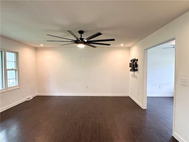 609 N Broadway St, Knob Noster, MO 65336 - spare room featuring dark wood-style flooring, a ceiling fan, baseboards, and recessed lighting